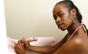 Black girl is giving him a sensational handjob in a POV gallery