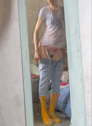 Self conscious looking chicky chick  shows her thin body here