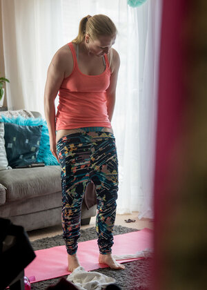 Ponytailed female undressing and also looking hot in the process