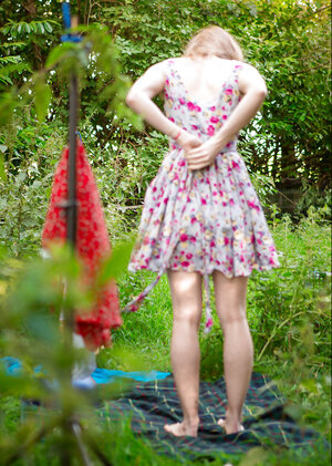 Slender babe decides to strip outside to show off her body