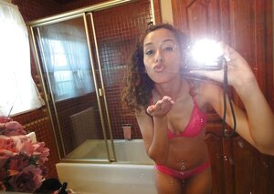 Curly Latina student gal takes some intimate pics in the bathroom