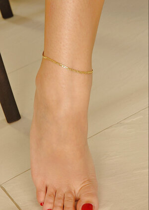 Adorable kitten with long legs teasing the lens in a solitary scene