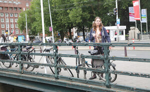 Rotund girl with a goofy hairdo showing her things in public