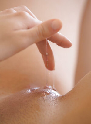 Deluxe redhead gazes down at her own pussy while jerking off