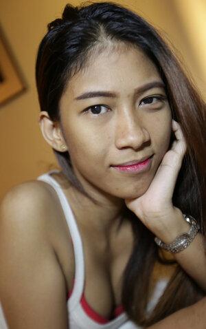 Underweight Thai 18-19 y.o. shows off her perky tits and a hairy pussy