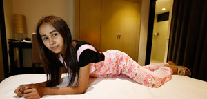 Edgy Thai chick named Puy is going to smoke and tease in overalls