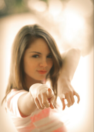 Long-legged adult model Aspen Martin shows off her tight bum