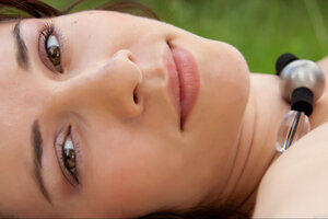 Katy C shows off her superb tits outdoors while nude