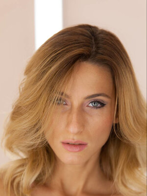 Blonde legal teen with a fat ass playing with her clean-shaven vagina