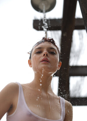 Short red-haired babe with freckles smokes after getting wet