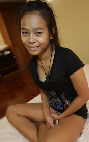 Little Asiatic is happy to open her vag for a large UK flag pole