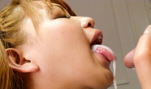 Redheaded Ruru Kashiwagi enjoys a cumshot on face after a blowjobs