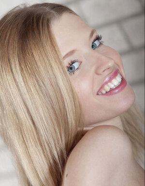 Natural blonde Angel Hot spreads her legs in cotton panties and also fondles her tiny tits