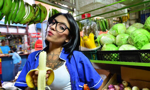Tattooed Marly Romero licks banana lascivious in public