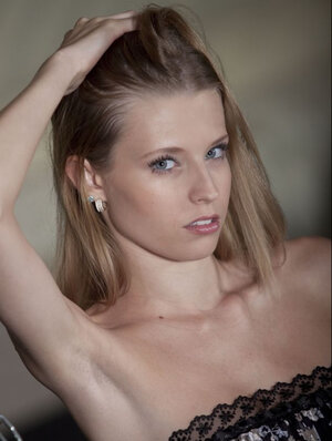 Angel Hott uncovers her firm bra buddies for a topless solo shoot