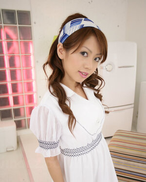 Modest Japanese cutie pie dressed in white dress that accentuates her slimness