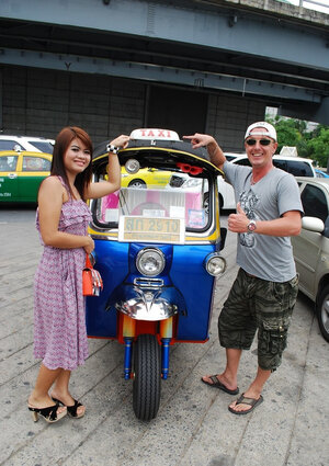 Asiatic teen Tukta with red hair wears sexy violet dress and prefers Tuk Tuk taxi