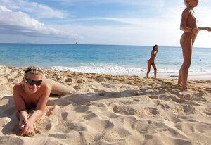 Group of youthful slutty babes pose wholly naked on the beach with no shame