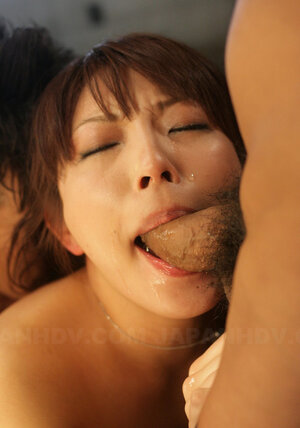 Young-looking Japanese dame with a gun in her hands is nailed by two perverts