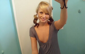 Playful chick makes erotic selfies showing off her nude body in the bathroom