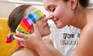 Lesbians in striped over-the-knee socks are in the mood to give fuck holes pleasure