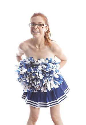 Funny red-haired high-school cheerleader Penny Pax strips while dancing