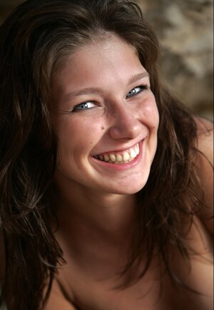 Sweet porn model with blue eyes and besides besides hot tits strips and besides besides poses on the rocky beach