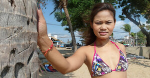 Thai kittens rest on a beach and plus pose in tight bikini flashing innie navels