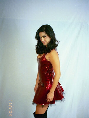 Soccer mom in a red dress looks aggressively into the camera and exposes her tits