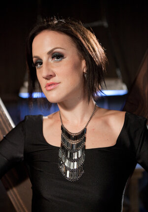 Corrupted ladies playfully pose with their nude bodies shown in BDSM dungeon