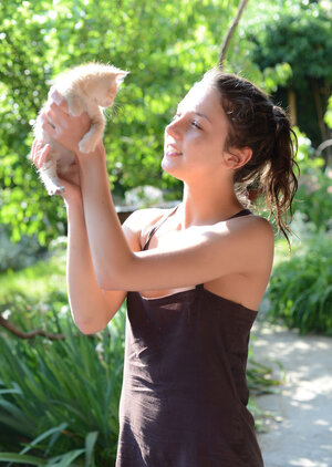 Teenage sweetie with freckled face likes to walk without clothes on the beach