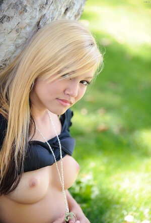 Blonde kitten in checkered sjort is shy finding quiet place for masturbation