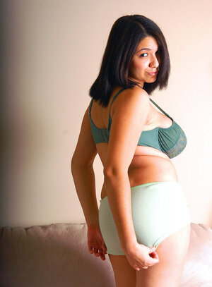 Brunette demonstrates her hefty bra buddies in sexy bra and huge booty in shorts