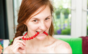 Pale girl Irina takes off floral dress and furthermore inserts red beads in the juicy pussy