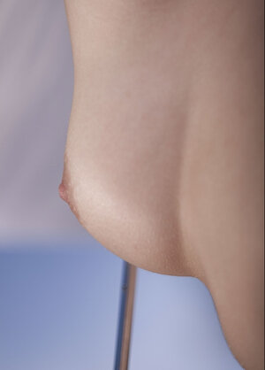 Delectable Slovakian brunette unclothes outdoors holding the umbrella