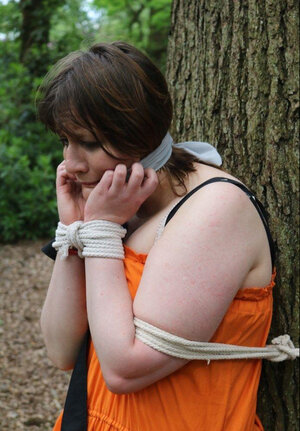 Helpless housewife is captured by lover and moreover pinioned up to tree in public park