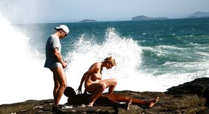 Big-breasted blonde MILF double penetrated on rocky coast by white and also black guys