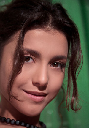 Tasty-looking young and fresh brunette reveals cute holes and titties posing on the stairs