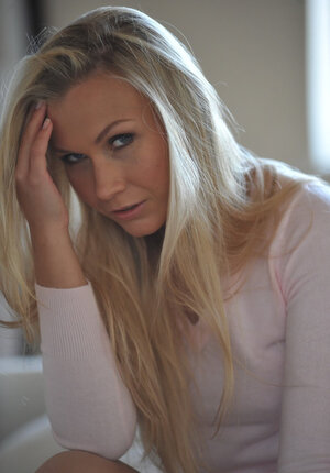 Playful blonde sexpot is not afraid to get naked and expose her sexy curves