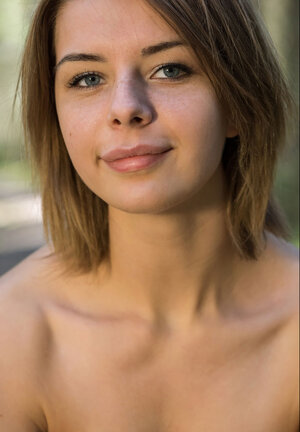 Mouth-watering teeny casts off each and all clothes to shake her big tits in the woods