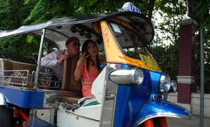 Joyful Thai minx poses near white fellow and moreover his impressive auto rickshaw