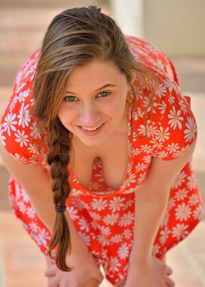 Pigtailed beauty with large bobs is flashing her perfect honey pot