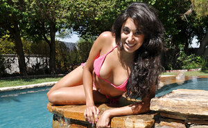 Tempting hoe Gia Steel posing outdoors in her pink bikini